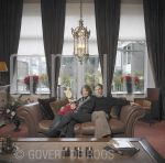 19-12-2003 Robert and Monique Schoemacher at home in Scheveningen.

[keywords]Posed: Full Length, Eyecontact, Livingroom, Plastic Surgeon[/keywords]